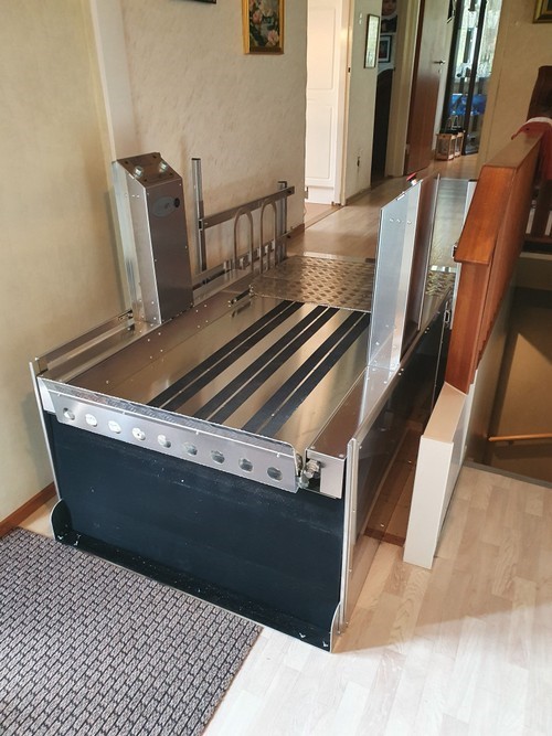 a metal bed frame sitting on top of a hard wood floor.